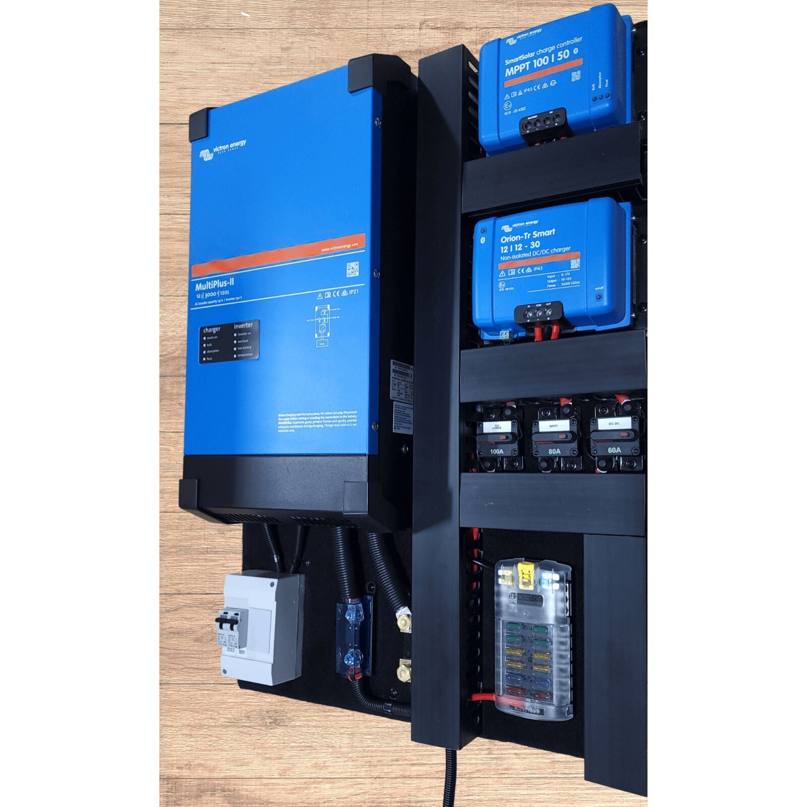 Pre-wired Victron board component layout showing MultiPlus-II inverter, MPPT, fuse block and circuit breakers